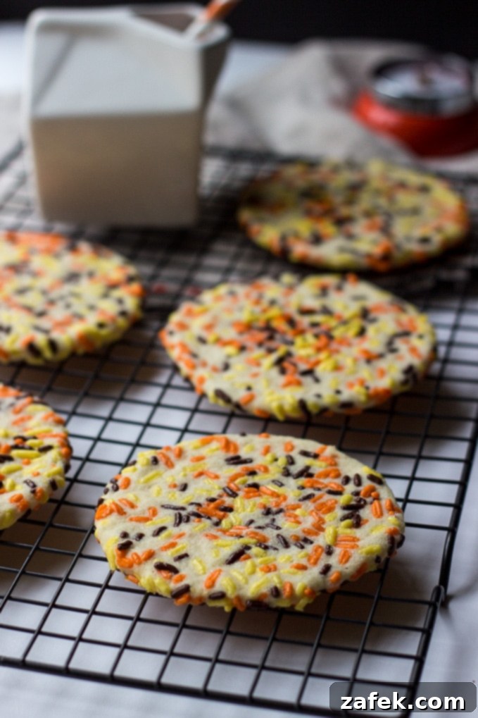 A festive plate of Classic Sprinkled Sugar Cookies, perfectly baked and adorned with sprinkles.