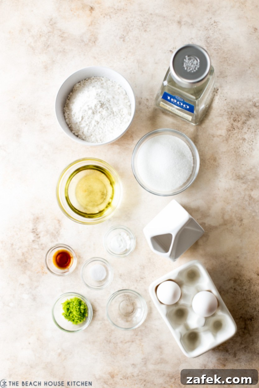 An overhead shot showcasing an array of margarita cupcake ingredients neatly arranged in various bowls on a pristine white surface