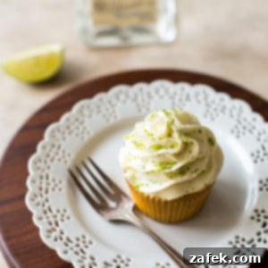 A frosted Margarita cupcake, garnished with lime zest, ready to be served