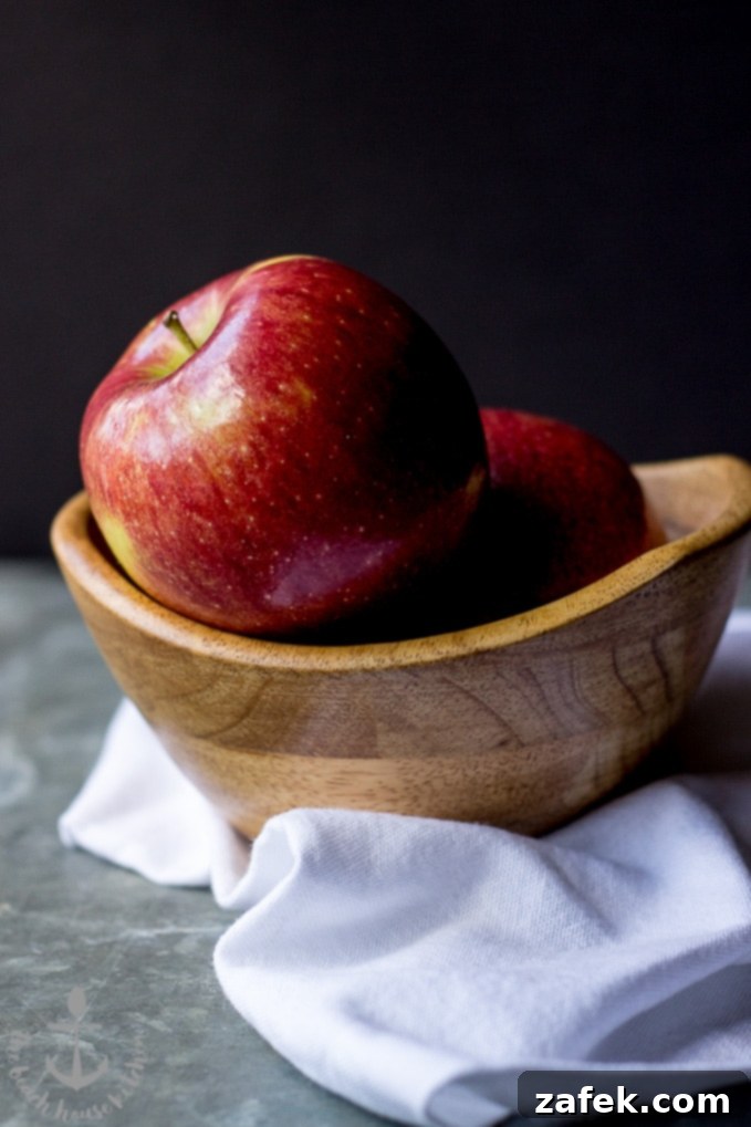 Sticky Caramel Apple Cranberry Upside-Down Loaf 4 Slice of Caramelized Apple Cranberry Upside Down Bread, revealing its moist crumb and fruit layers.