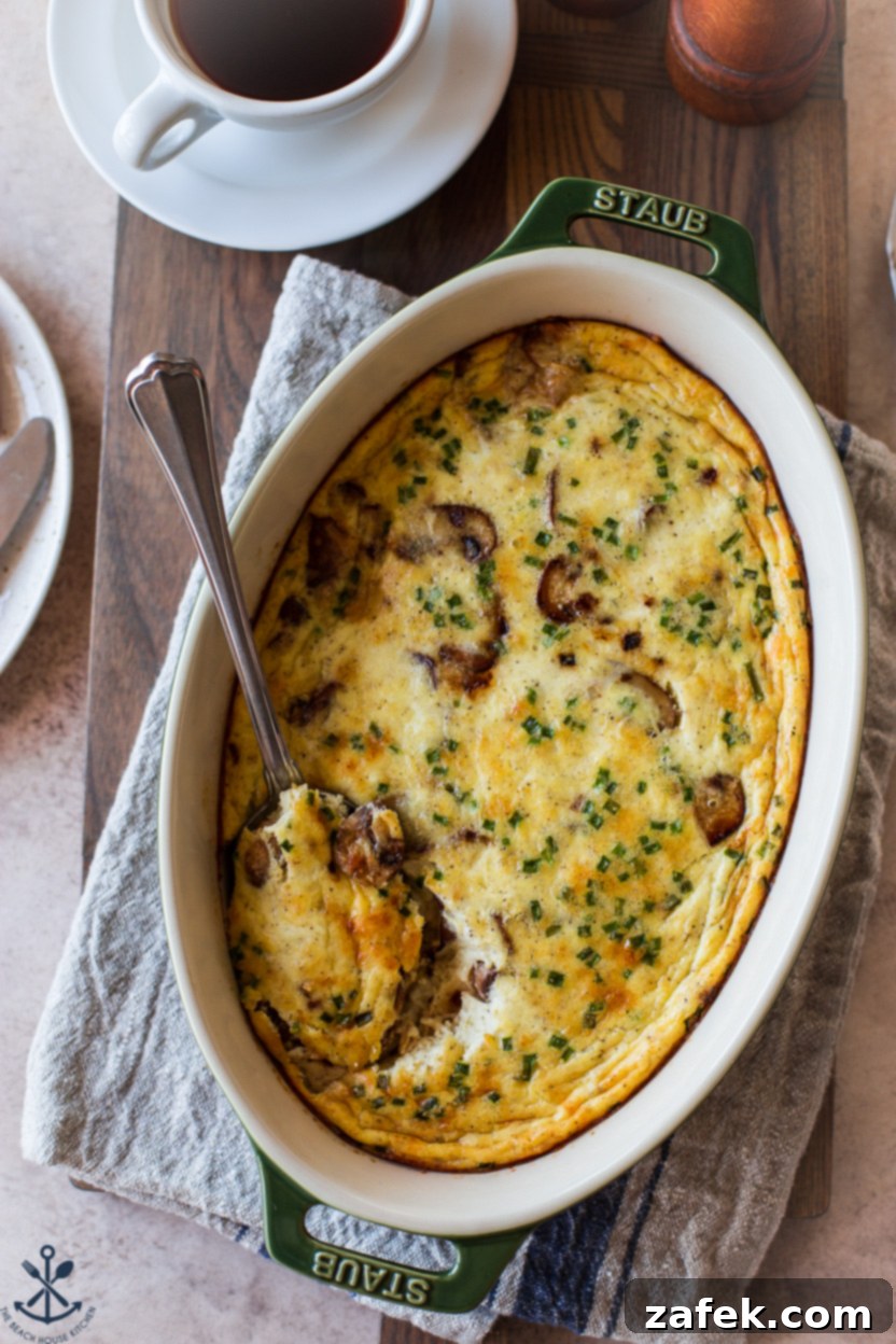 Savory Mushroom Cloud 2 Overhead photo of a golden brown crustless quiche in an oval baking dish, ready to be served