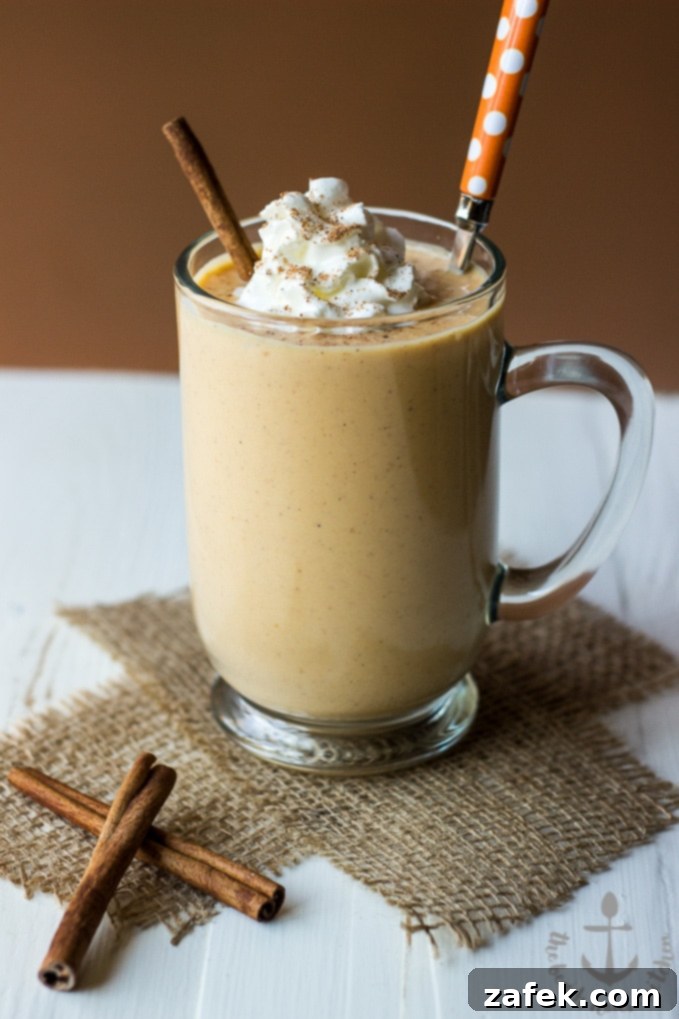 Cozy Spiced Pumpkin Sip 3 Close-up of a Pumpkin Pie Smoothie, showing its creamy texture and autumnal color.
