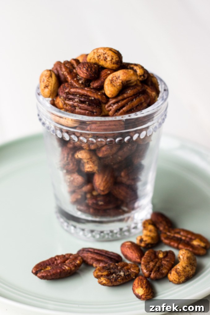 Hearthside Spiced Nuts 2 Spiced Holiday Nuts on a platter with cheese and crackers, ready for entertaining.