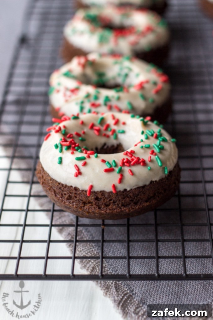Gingerbread Donut Bliss 2 Delicious Gingerbread Donuts with a Sweet Gingerbread Glaze, garnished with festive sprinkles