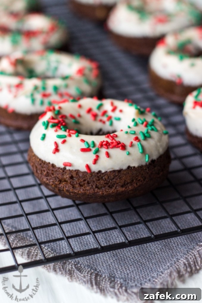 Gingerbread Donut Bliss 7 Several gingerbread donuts with glaze, artfully arranged on a serving plate