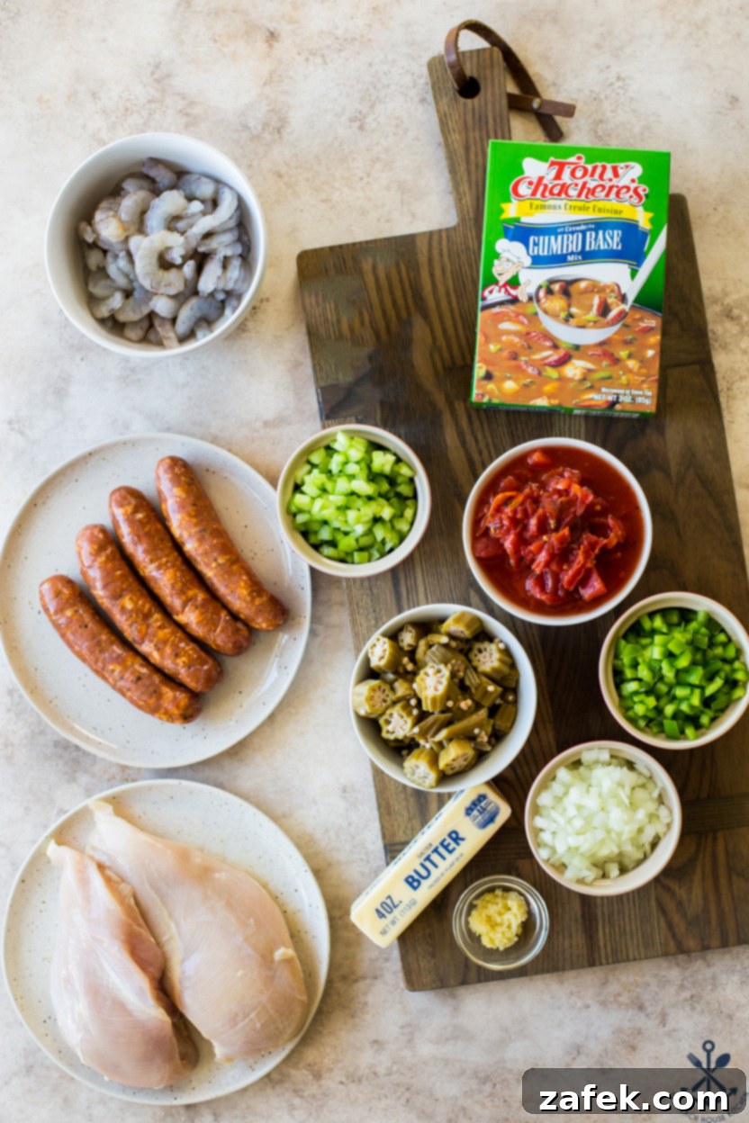 Overhead photo of ingredients for easy slow cooker gumbo on a wooden board