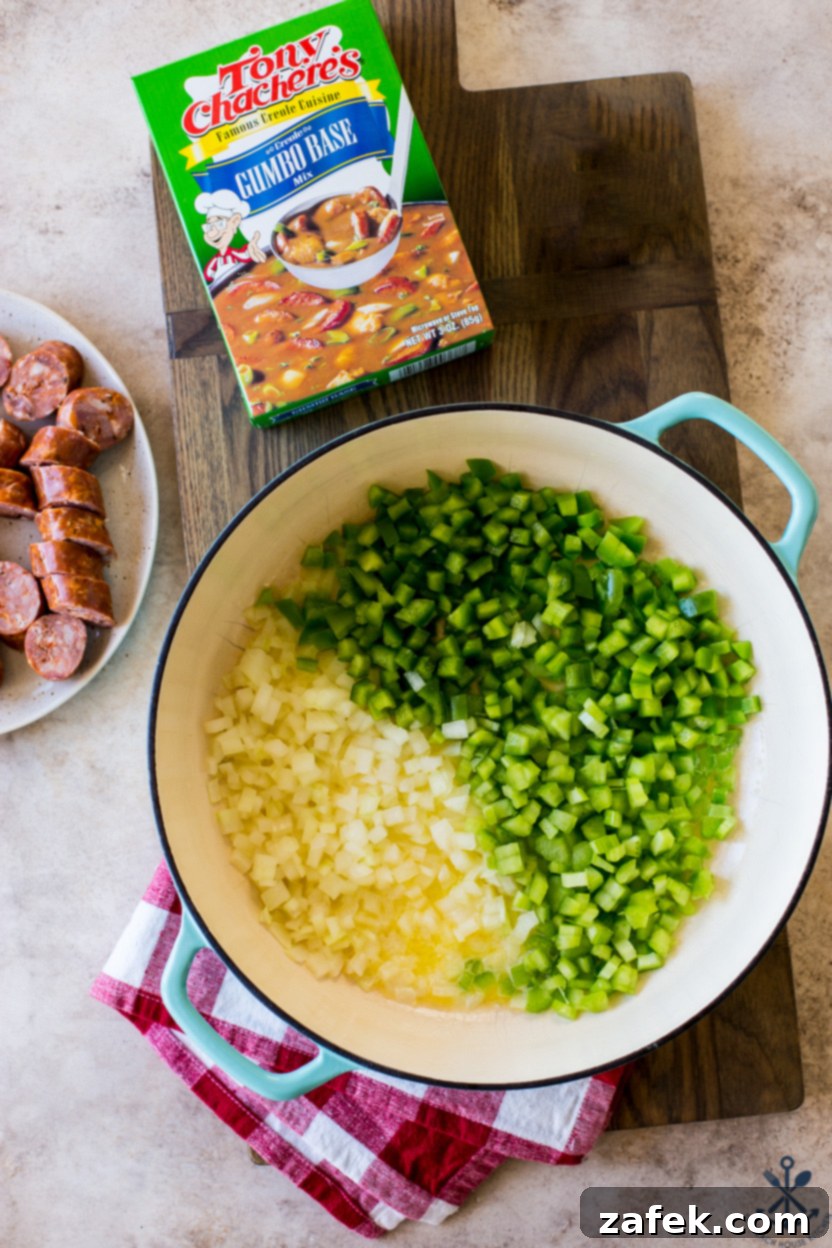 Overhead photo of a skillet of onions, peppers and celery