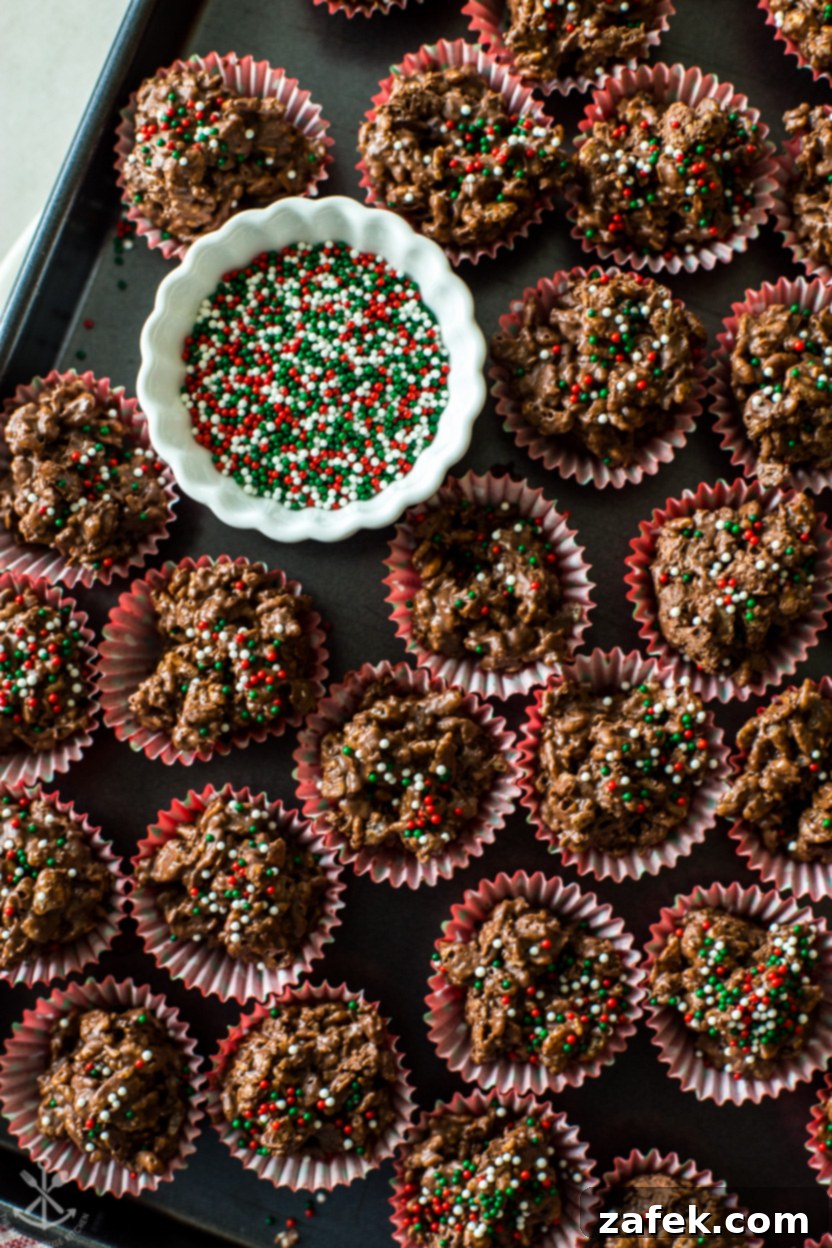 Overhead photo of a tray of crispy chocolate coconut crunch cups, featuring a dark chocolate coating and a sprinkle of festive nonpareils