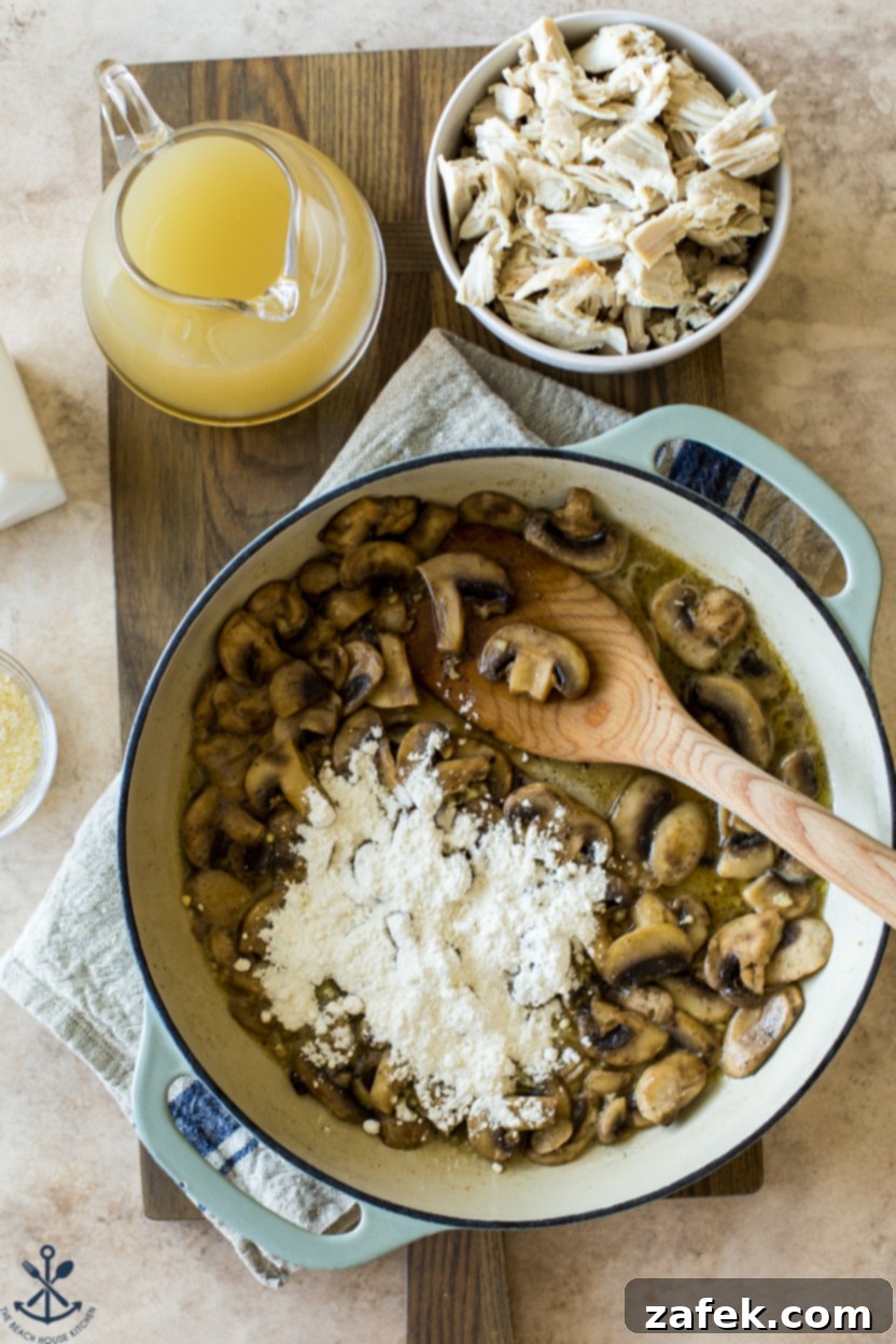 One-Pan Turkey Tetrazzini 5 Overhead photo of a skillet of mushrooms topped with flour