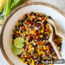 Lone Star Fiesta Salad 7 Overhead photo of a large bowl of Texas caviar with two lime slices.
