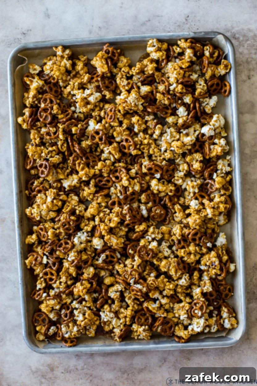Gourmet Gingerbread Caramel Pretzel Popcorn 2 Overhead photo of a tray of caramel popcorn with pretzels