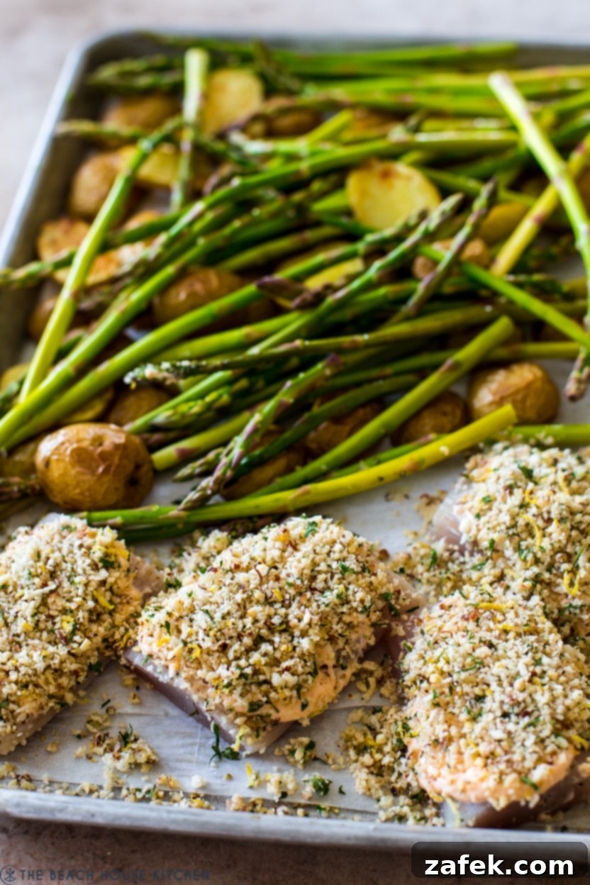 Effortless Sheet Pan Mahi Mahi with Crispy Potatoes and Asparagus 6 A tray of pre-cooked mahi mahi fillets with asparagus and potatoes