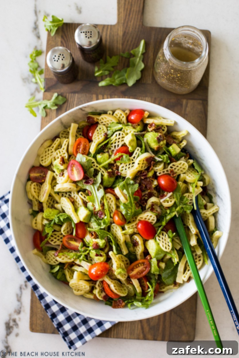 The Ultimate BLT Avocado Pasta Salad 2 Overhead photo of a bowl of BLT Avocado Pasta Salad with bacon, tomatoes, and avocado