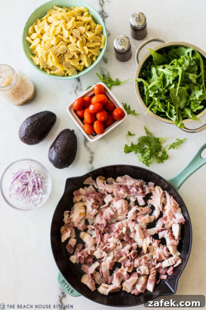 The Ultimate BLT Avocado Pasta Salad 3 Overhead photo of fresh ingredients for a BLT Avocado Pasta Salad arranged on a cutting board