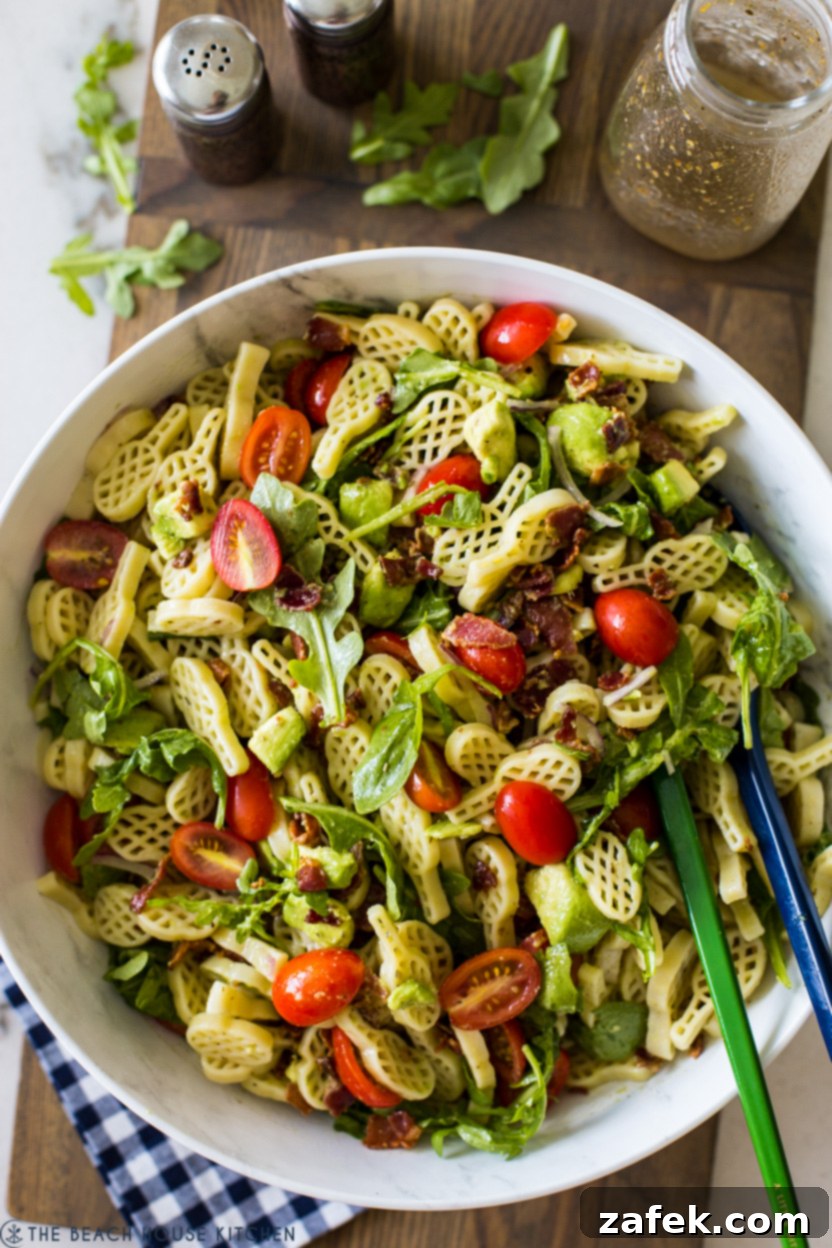 The Ultimate BLT Avocado Pasta Salad 7 Up close overhead photo of a serving of BLT Avocado Pasta Salad in a bowl