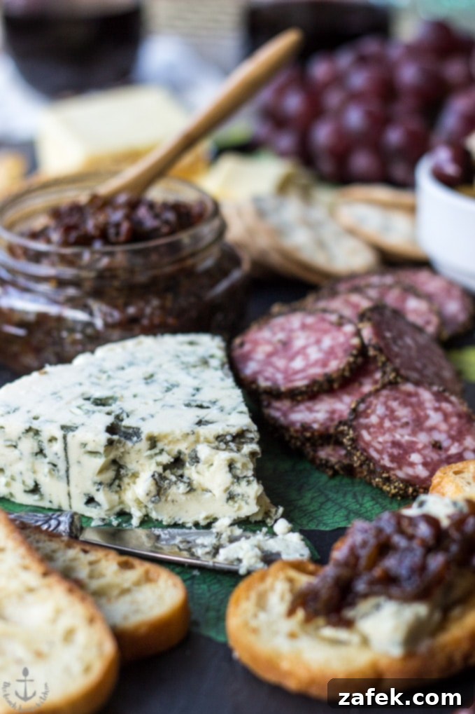 Date Night Indulgence: A Valentine's Cheese Board with Irresistible Bacon Onion Jam 4 Close-up of a gourmet cheese board spread