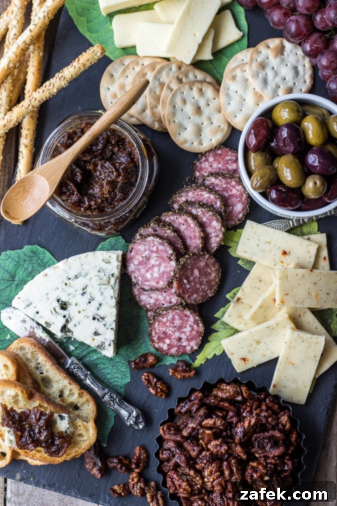 Date Night Indulgence: A Valentine's Cheese Board with Irresistible Bacon Onion Jam 5 Variety of cheeses on a wooden board