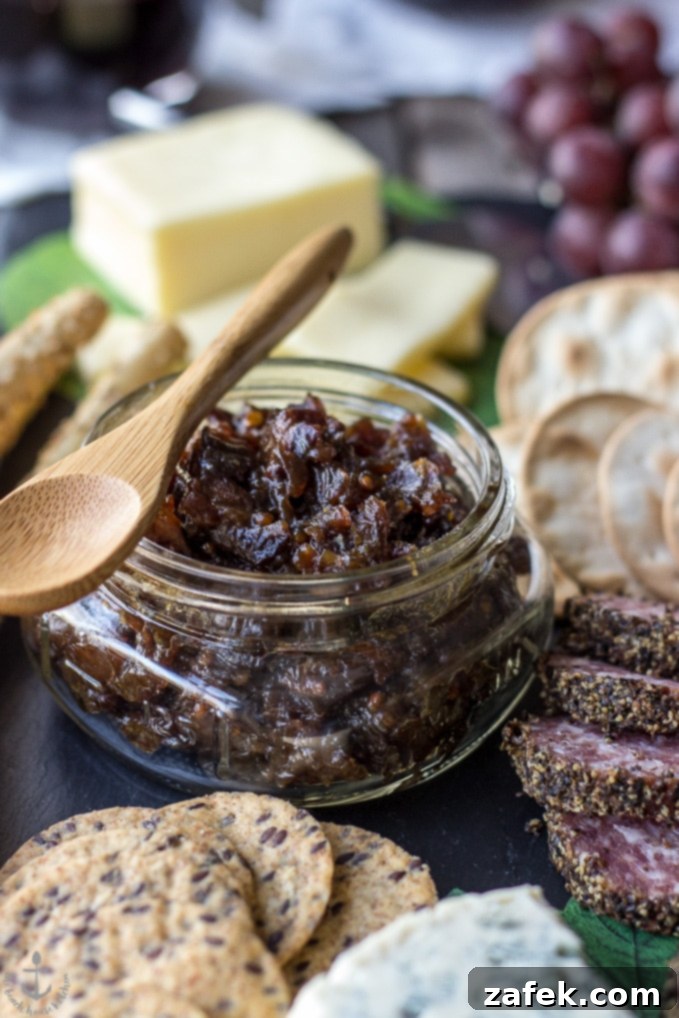 Date Night Indulgence: A Valentine's Cheese Board with Irresistible Bacon Onion Jam 6 Cheese board with grapes, crackers, and bacon onion jam