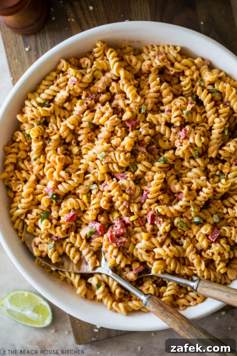 Overhead photo of a bowl of fully assembled Mexican Street Corn Pasta Salad, ready to serve