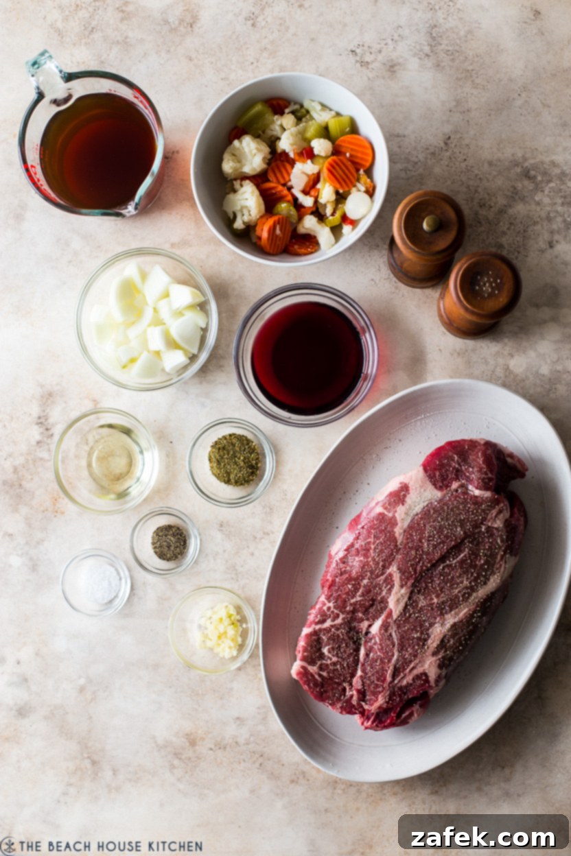 Overhead photo of ingredients for Italian beef dish, neatly arranged on a counter