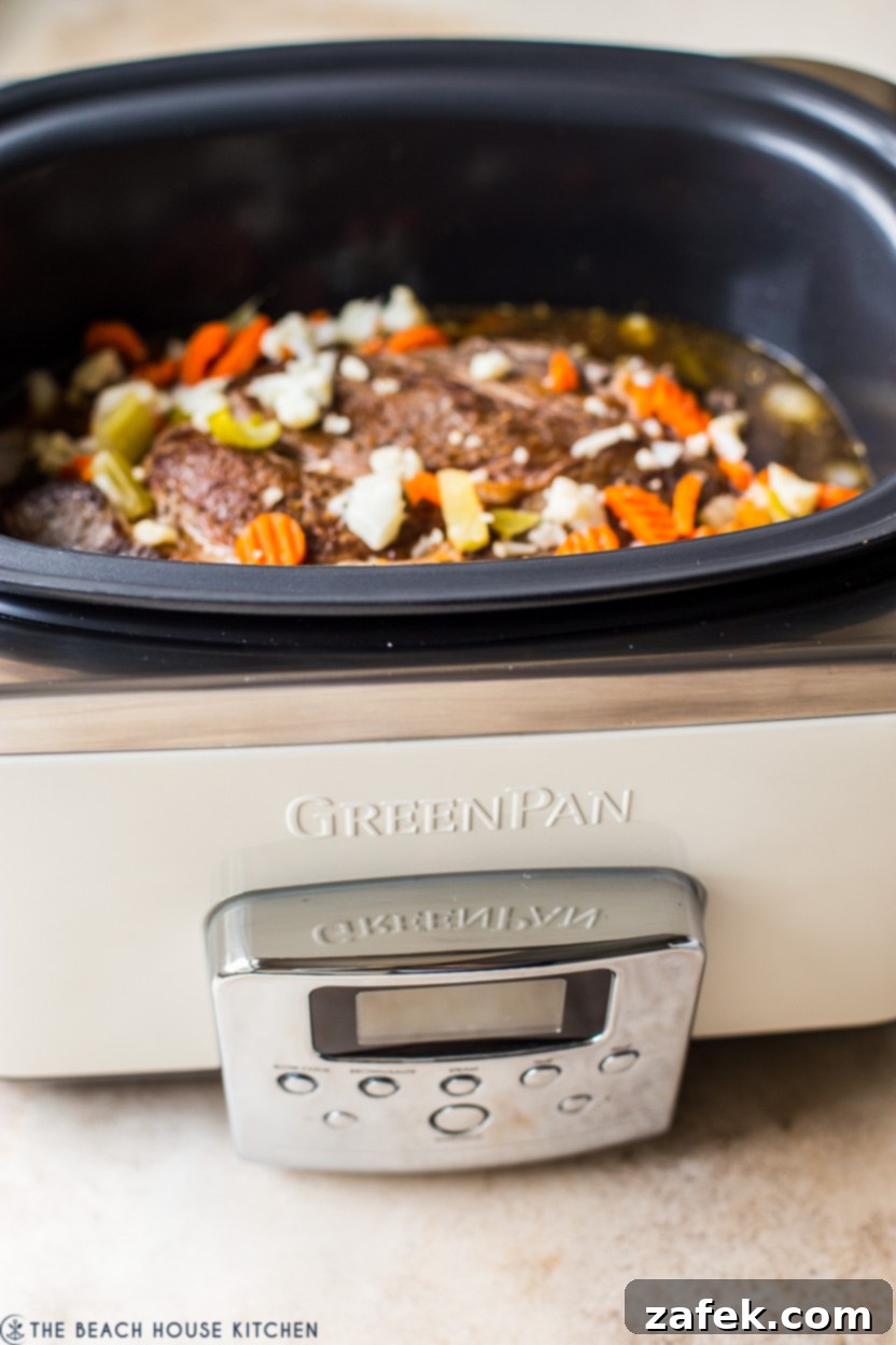 Up close photo of a GreenPan slow cooker, highlighting its sleek design