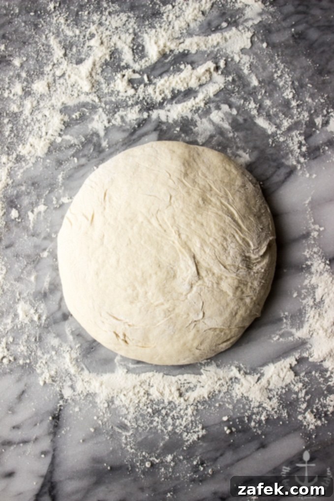 Detailed shot of the no-knead bread's interior, showing the large air pockets and fluffy texture
