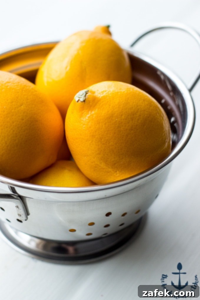 Ingredients for Meyer Lemon Cream Scones laid out, including fresh Meyer lemons, zest, and other baking essentials