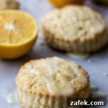 Meyer Lemon Cream Scones with lemon glaze on a white platter