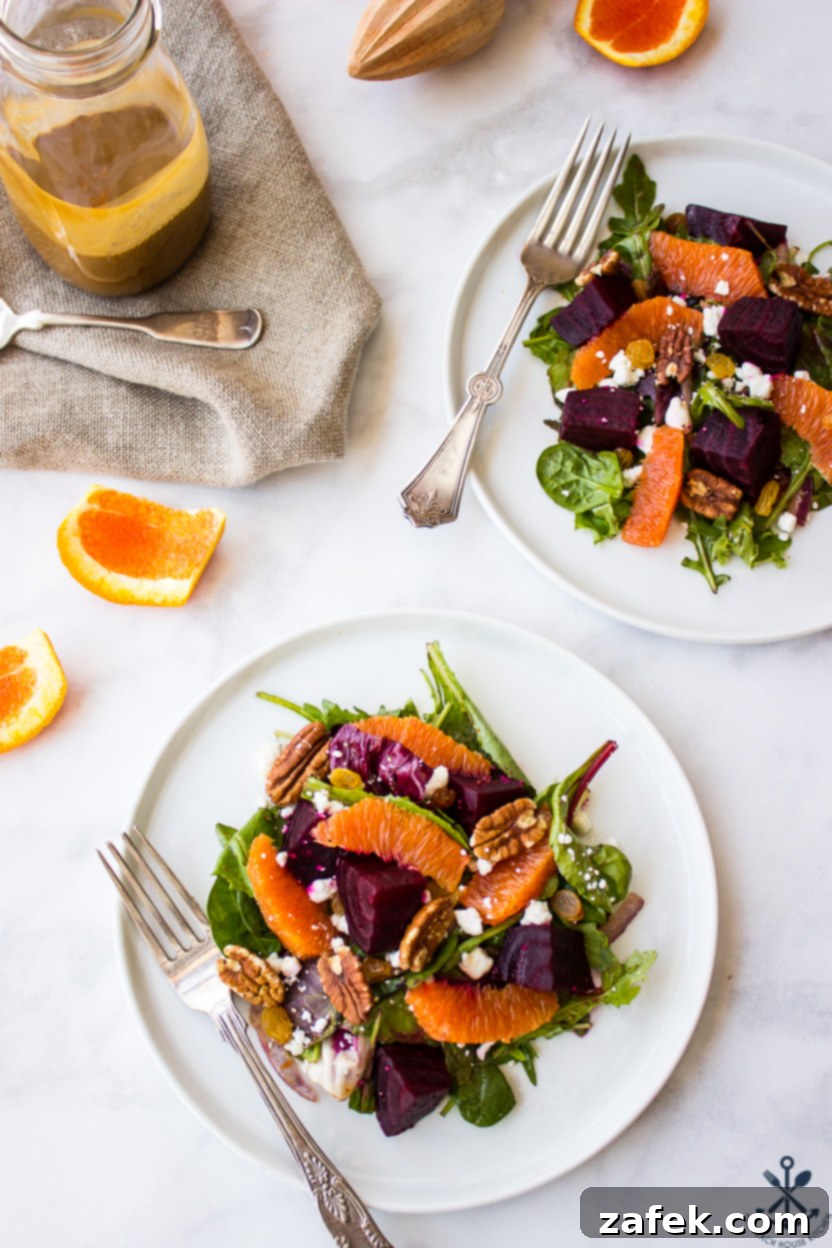 Vibrant Beet and Orange Salad 3 Overhead photo of two plates of salad with beets and oranges on white plates