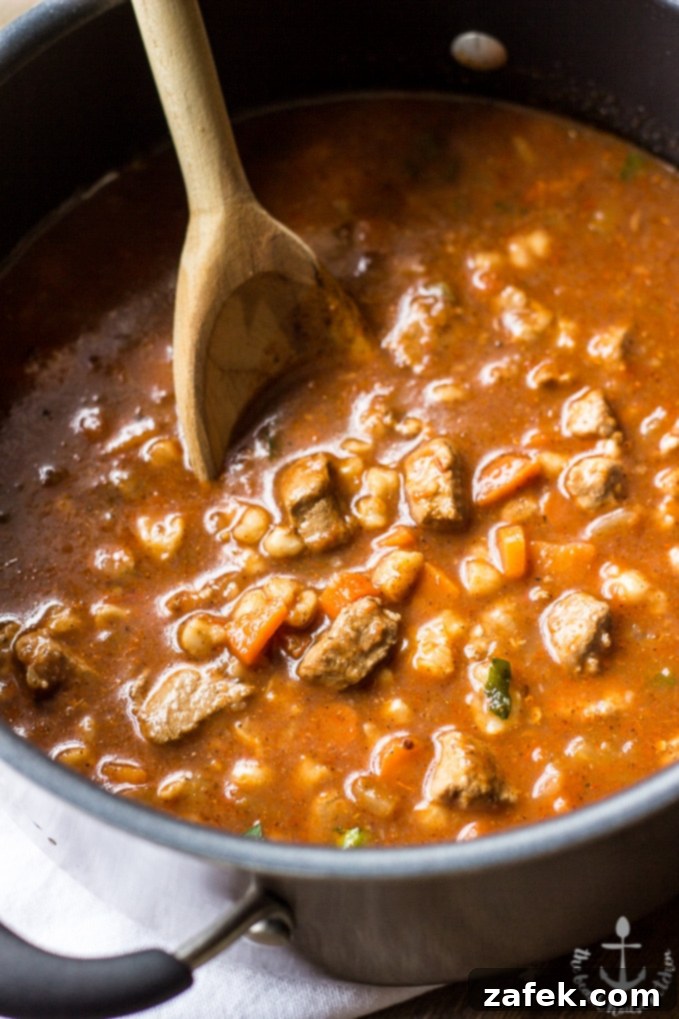 Finished bowl of Pozole with fresh garnishes