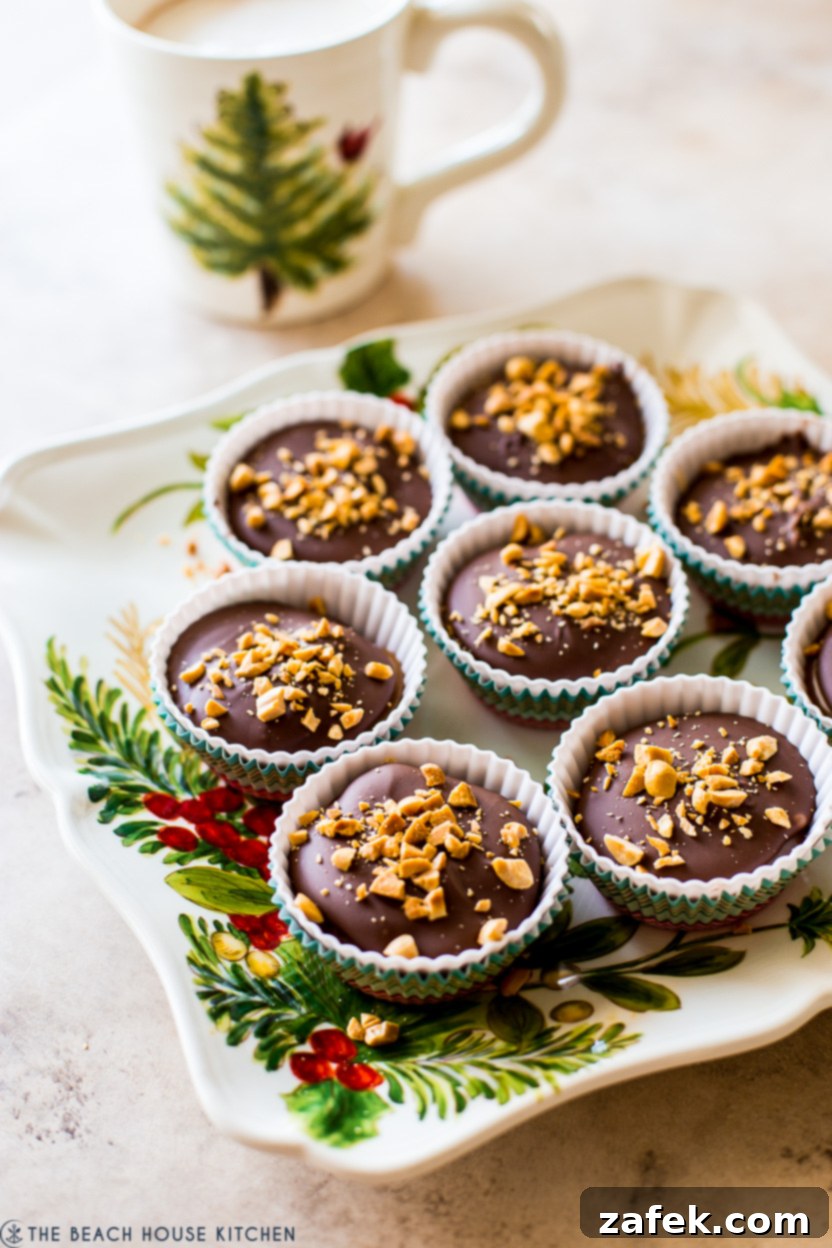 Caramel Peanut Chocolate Dream Cups 11 A festive holiday plate generously filled with beautifully arranged homemade Snickers cups, ready for joyful and delicious enjoyment.