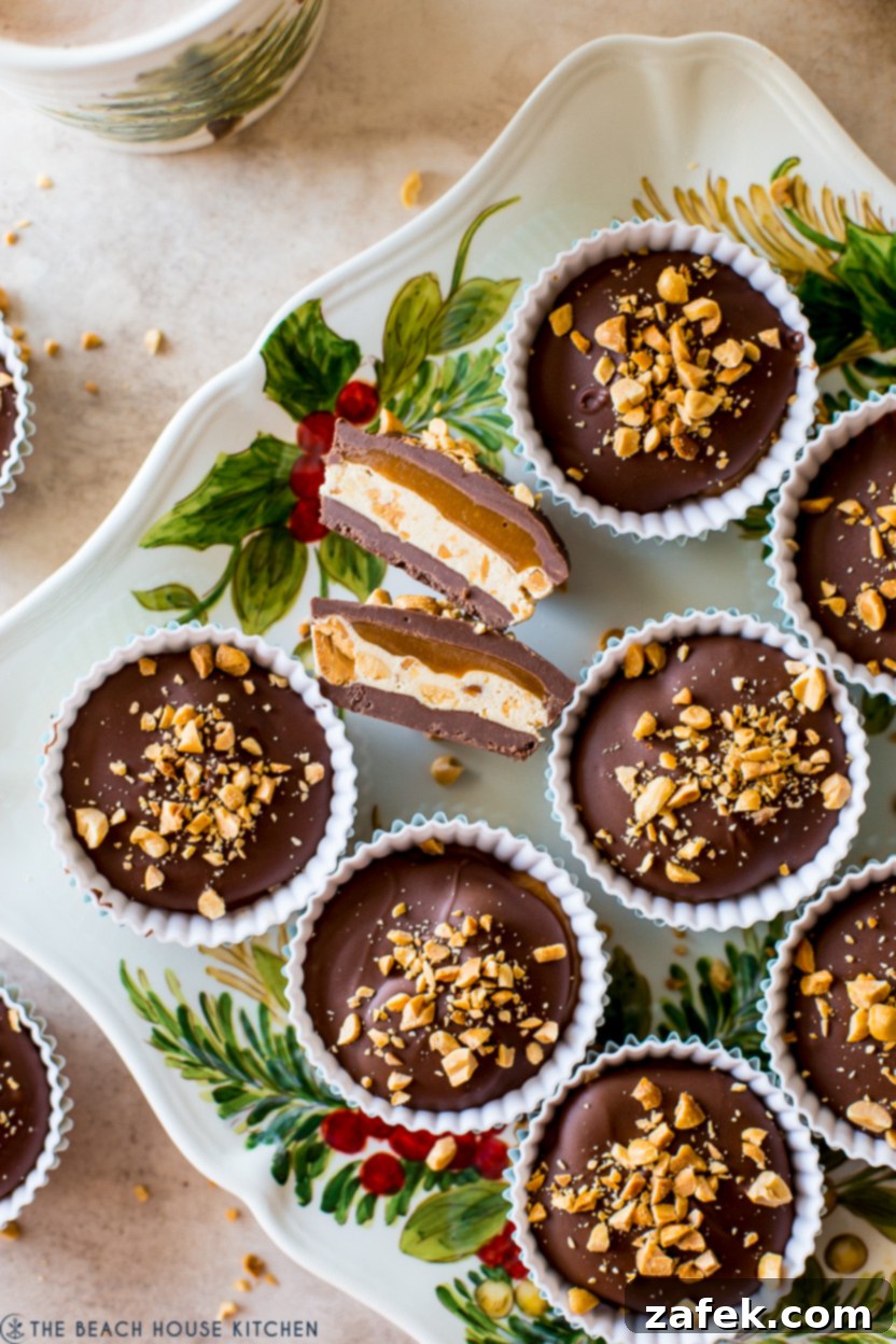 Caramel Peanut Chocolate Dream Cups 4 A close-up shot of a single homemade Snickers cup, perfectly revealing its intricate layers and appealing texture.