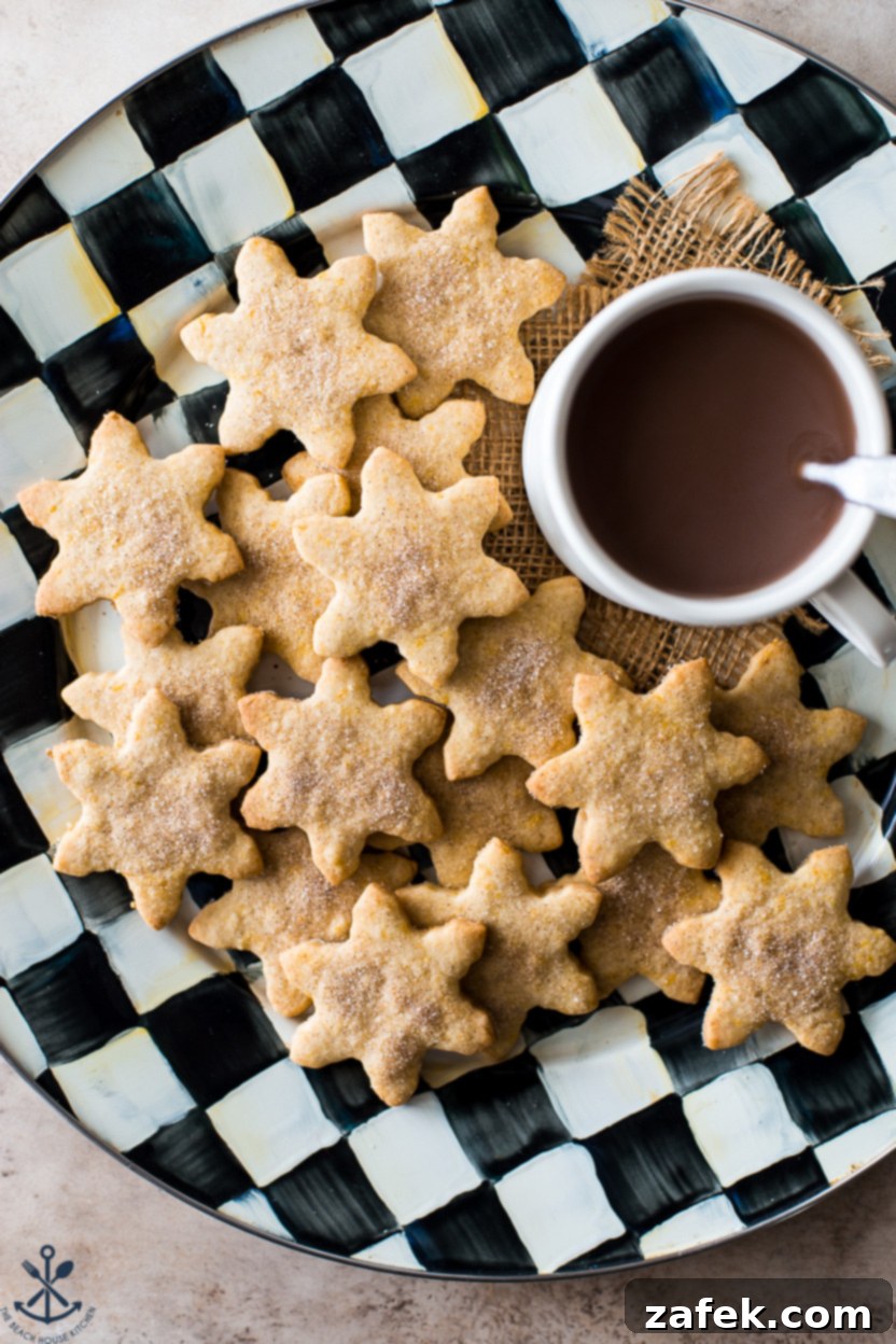 Overhead photo of a checkered platter of snowflake cookies