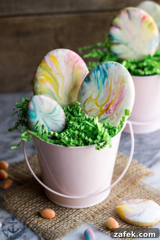 Easter Egg Sugar Cookies with Marbled Royal Icing, showcasing beautifully decorated cookies on a festive platter