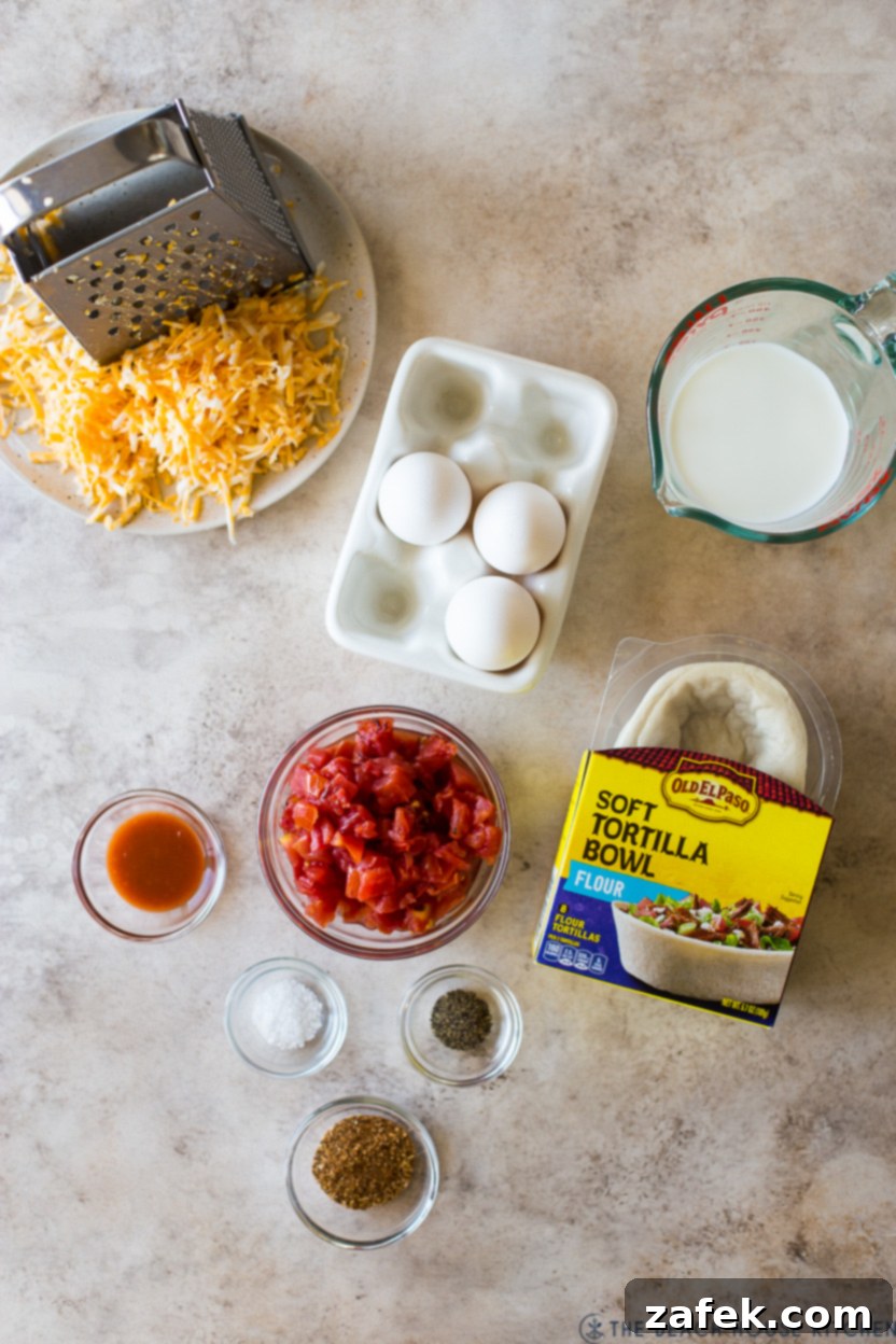Loaded Mexican Quiche Boats 4 Overhead photo of ingredients for taco boat quiches, including eggs, cheese, Ro-Tel, and seasoning