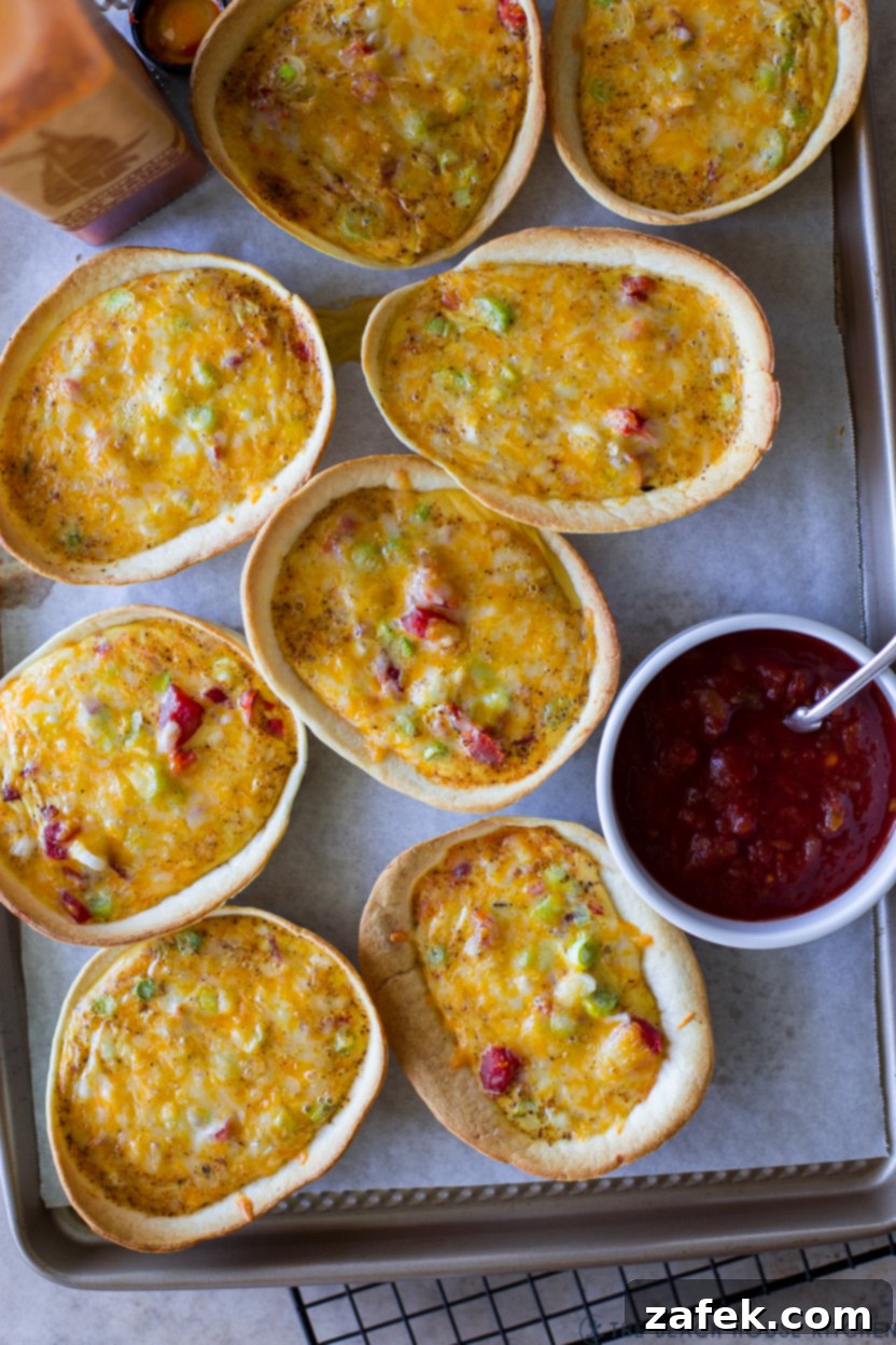 Loaded Mexican Quiche Boats 8 Up close overhead photo of freshly baked Mexican Taco Boat Quiches, golden and bubbly