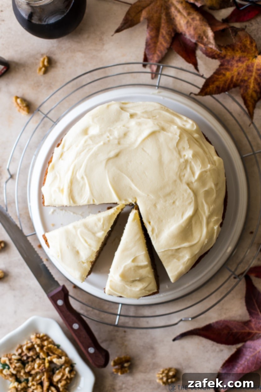 Maple Walnut Cake 9 Overhead photo of a cake topped with cream cheese frosting