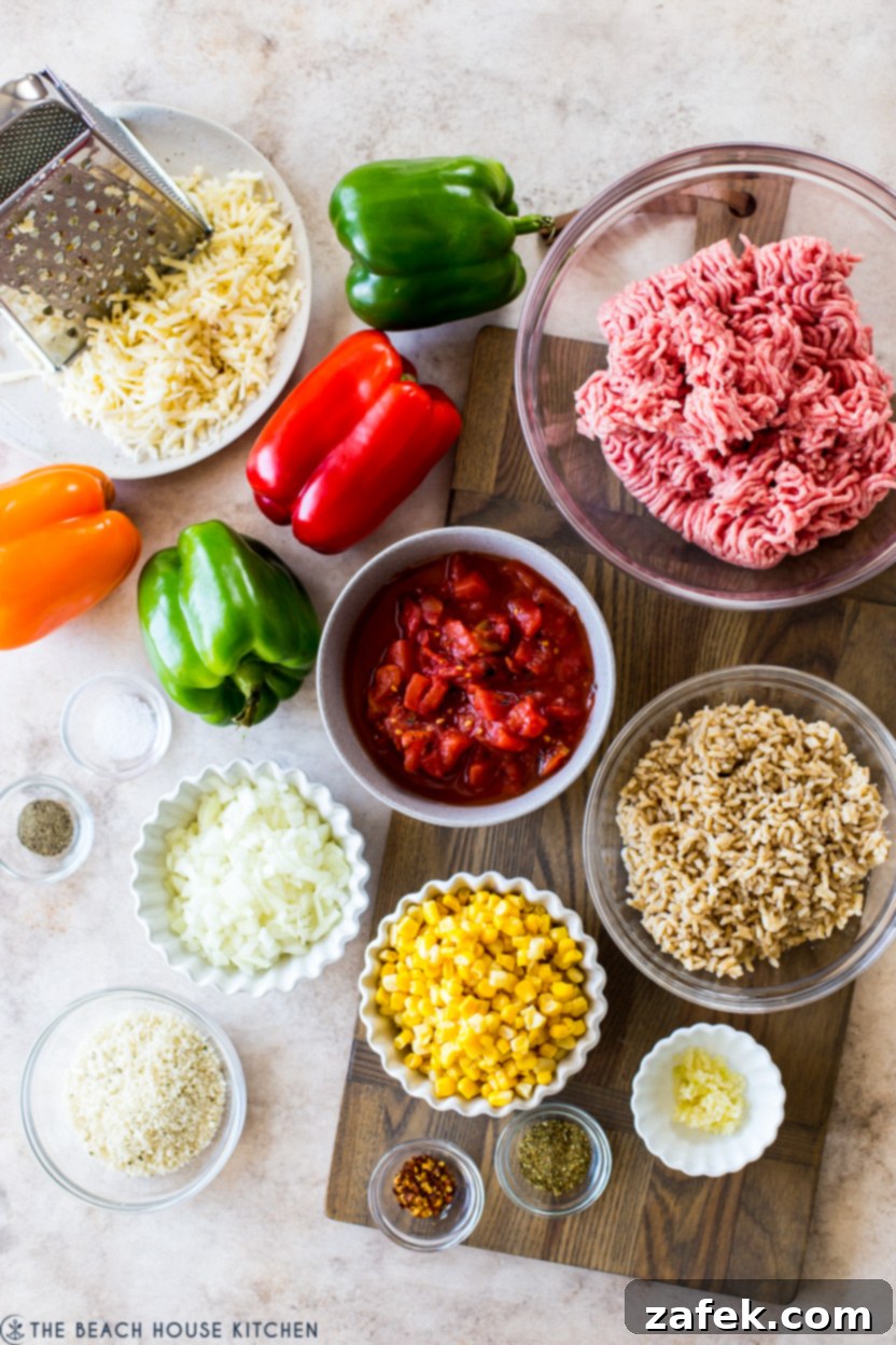 Savory Stuffed Peppers 4 Overhead photo showcasing an array of fresh ingredients for stuffed peppers, neatly arranged in small bowls on a wooden surface
