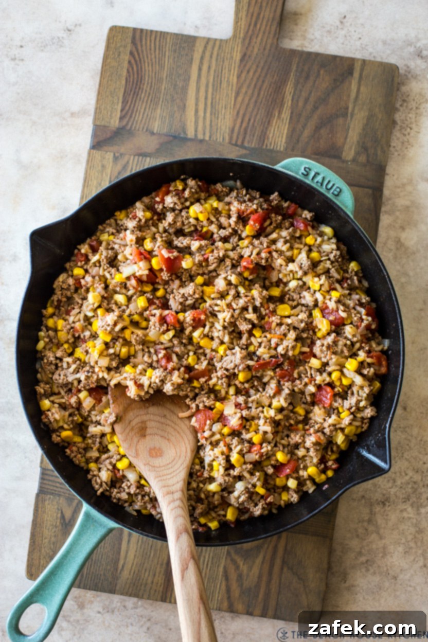 Savory Stuffed Peppers 8 Overhead photo of a skillet overflowing with the savory stuffed pepper mixture, showcasing its hearty texture and rich ingredients