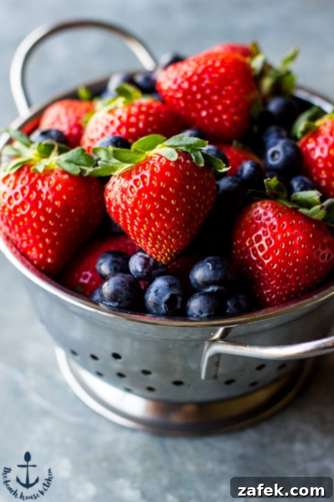Freshly prepared Coconut Crepes stacked with berries and yogurt