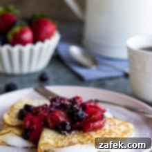 Coconut Crepes with Whipped Greek Yogurt and Berry Compote