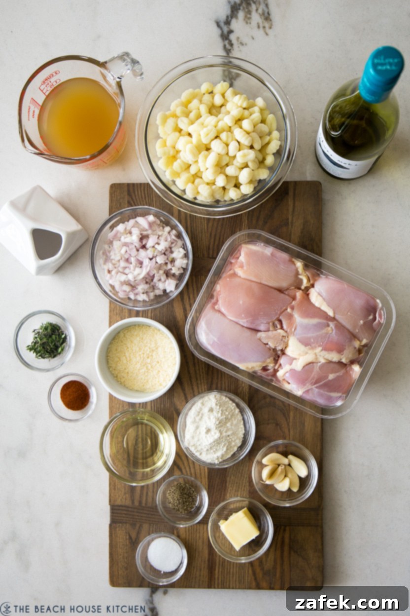 Luscious Garlic Chicken Gnocchi 4 Overhead photo of fresh ingredients for a creamy chicken gnocchi dish laid out on a table