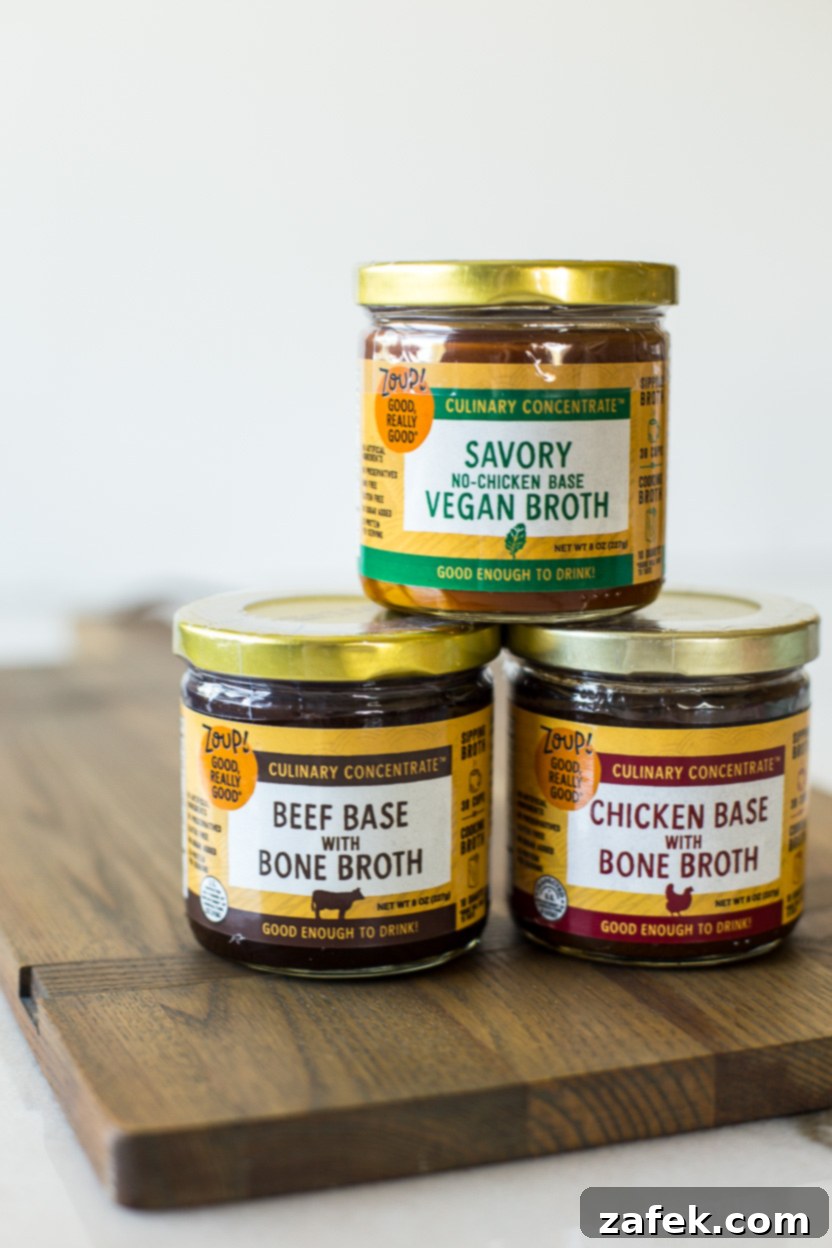 Three elegant glass jars of Zoup! Good, Really Good® bone broth culinary concentrates, showcasing the variety within their product line