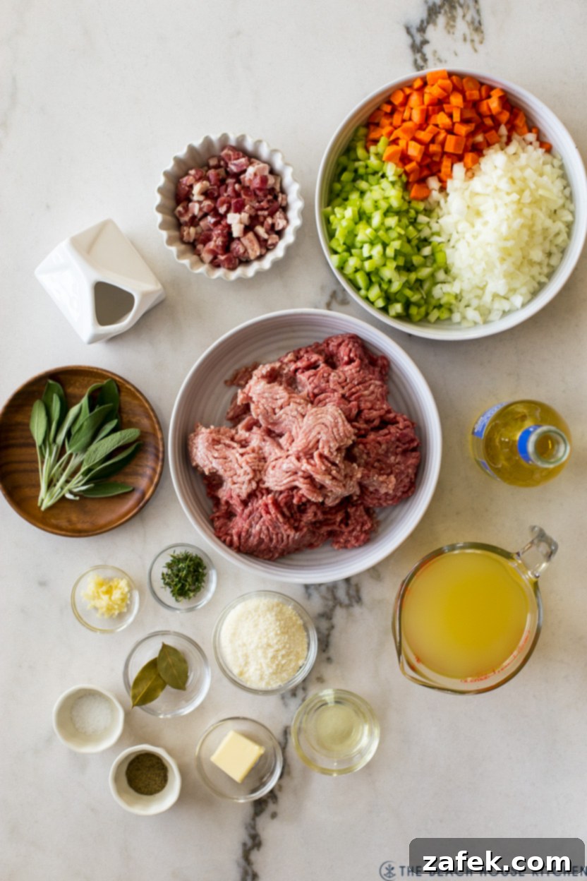Bianco Bolognese 4 An overhead view of all the fresh, high-quality ingredients neatly laid out on a kitchen counter, prepared for making White Bolognese, including vegetables, herbs, meats, and dairy.