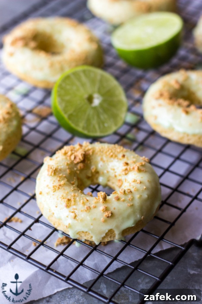Delicious Baked Key Lime Pie Donuts with a vibrant glaze and graham cracker crumbs