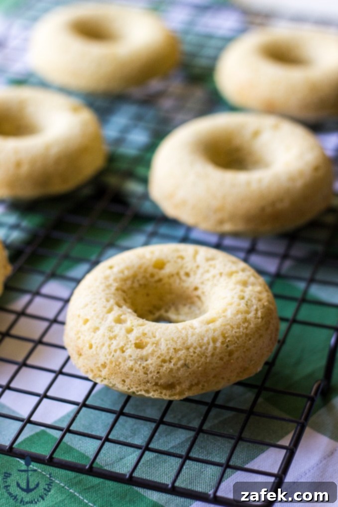Close-up of Key Lime Pie Donuts showing the vibrant green glaze and graham cracker topping