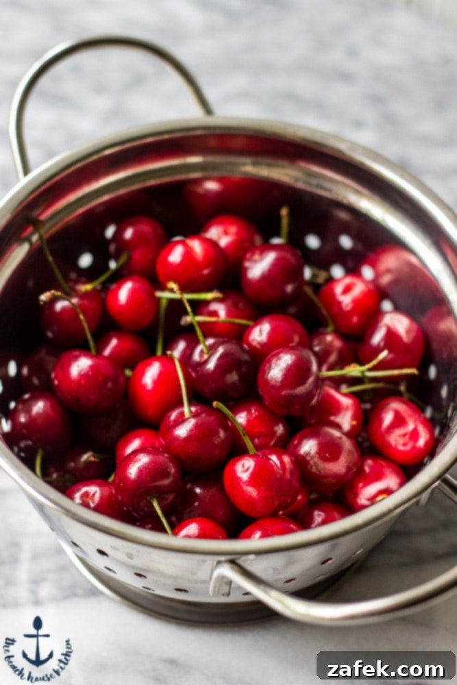Artfully drizzled Cherry Vanilla Scones on a wire rack
