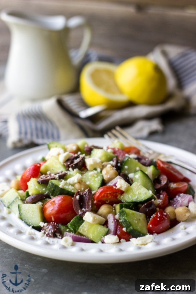 Fresh Mediterranean Cucumber Salad served in a bowl, showing vibrant cucumbers, tomatoes, olives, and feta.