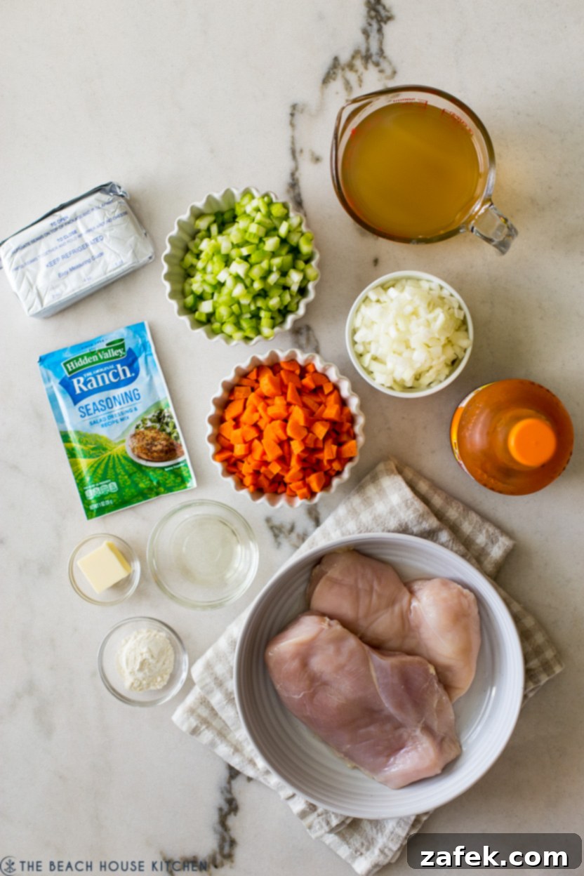 Hot Wing Soup 4 An overhead view of all the fresh and vibrant ingredients for buffalo chicken soup, neatly arranged on a kitchen counter, ready for preparation.