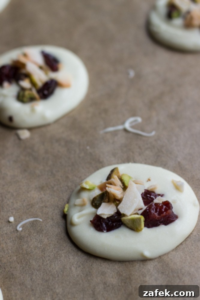 Assorted Christmas Mendiants artfully arranged, showcasing their vibrant toppings and festive appeal.